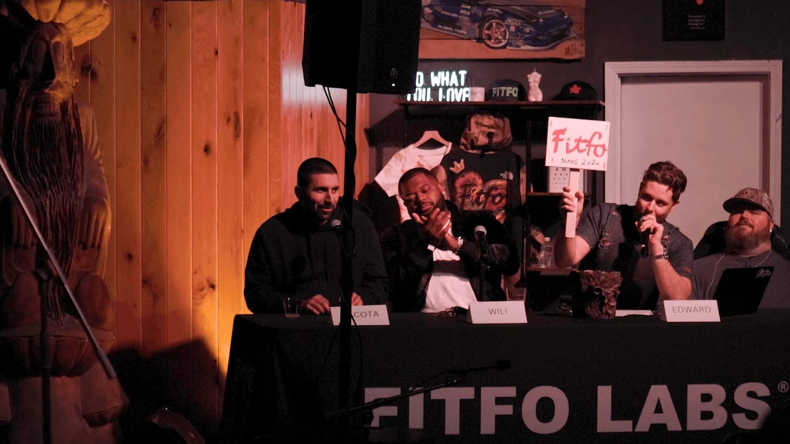 Judges sit at the Fitfo Labs table during a showcase night, Nite in the Lab